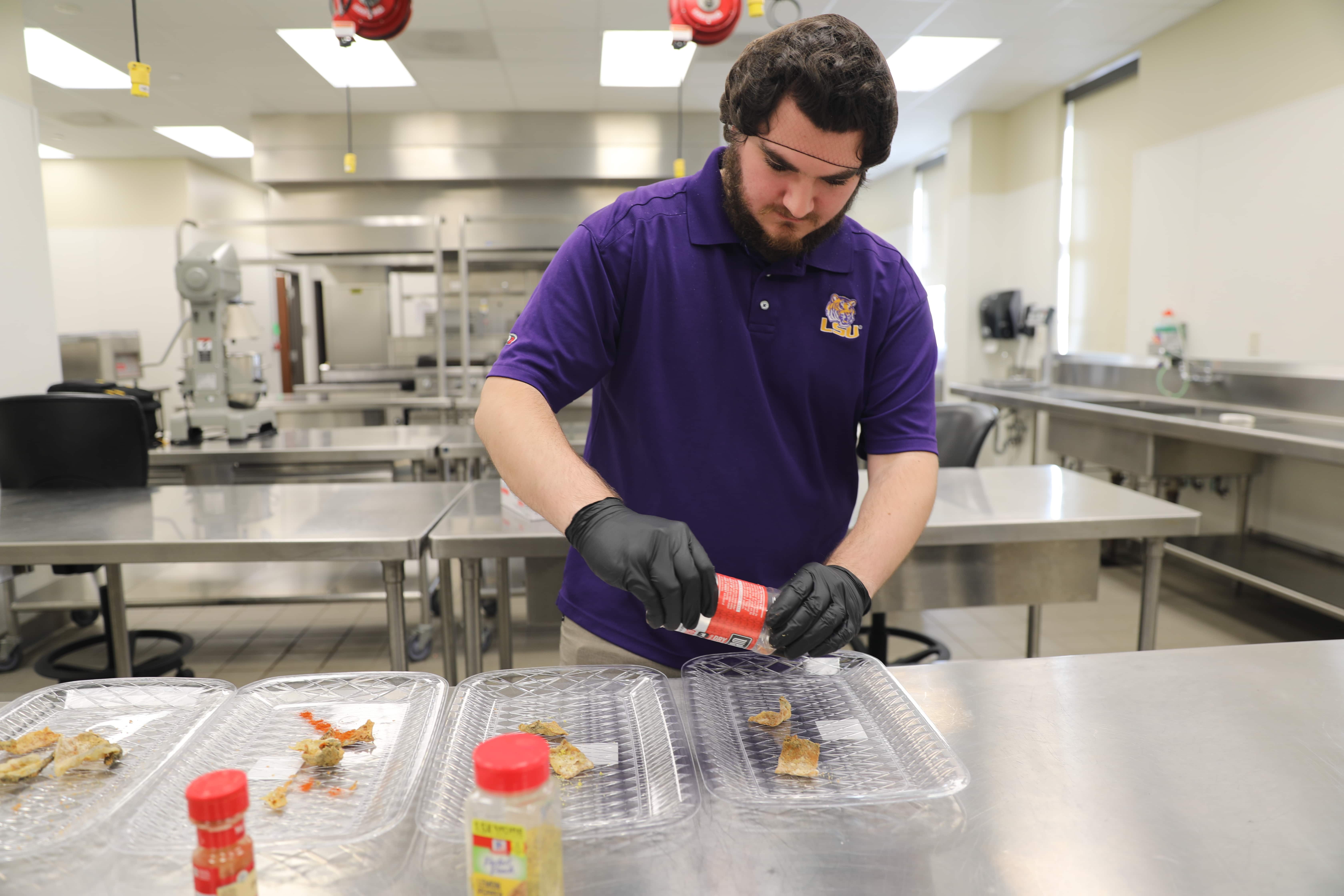 Nick Musso seasoning catfish chips