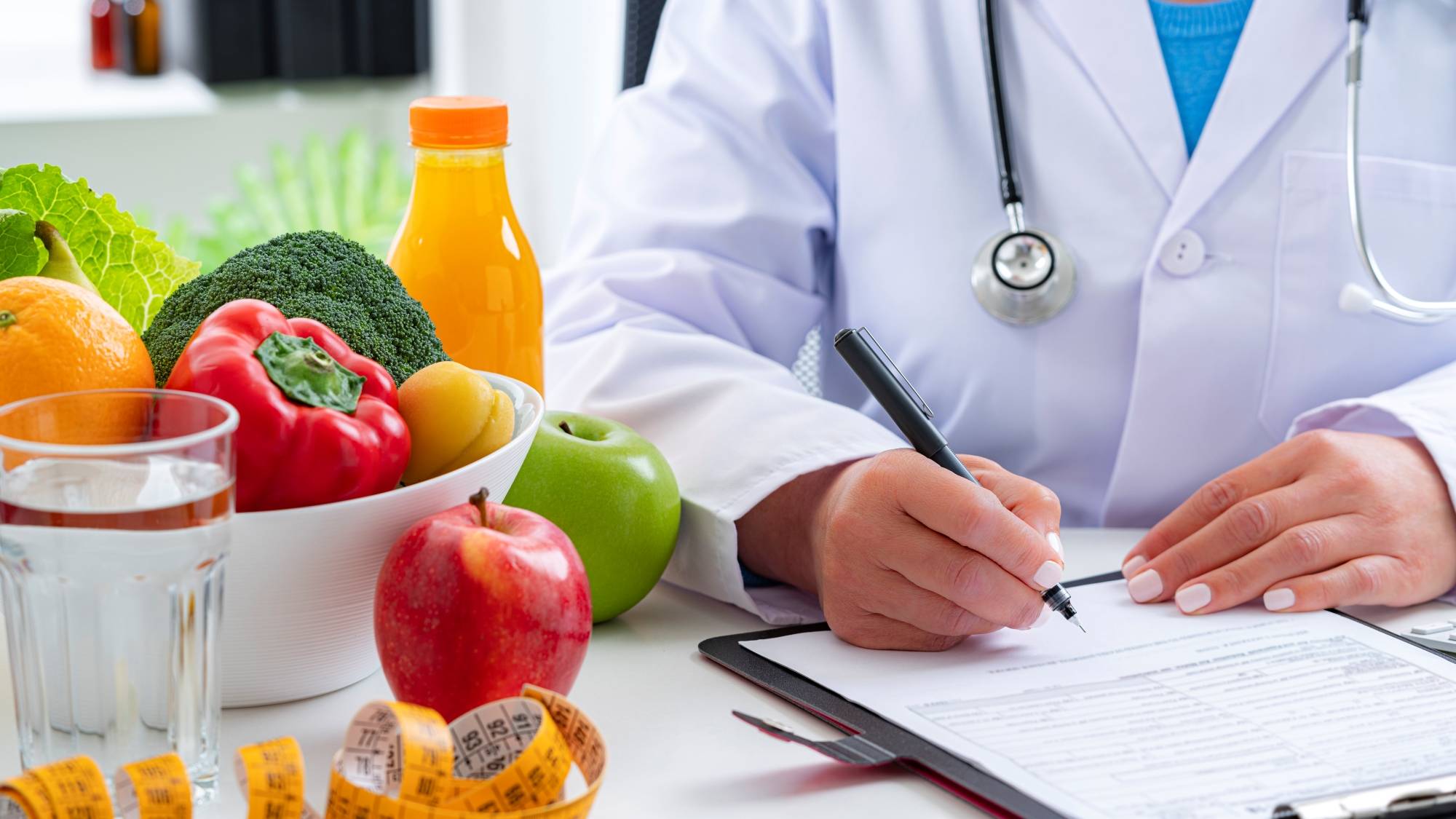 doctor with bowl of vegetable and fruit