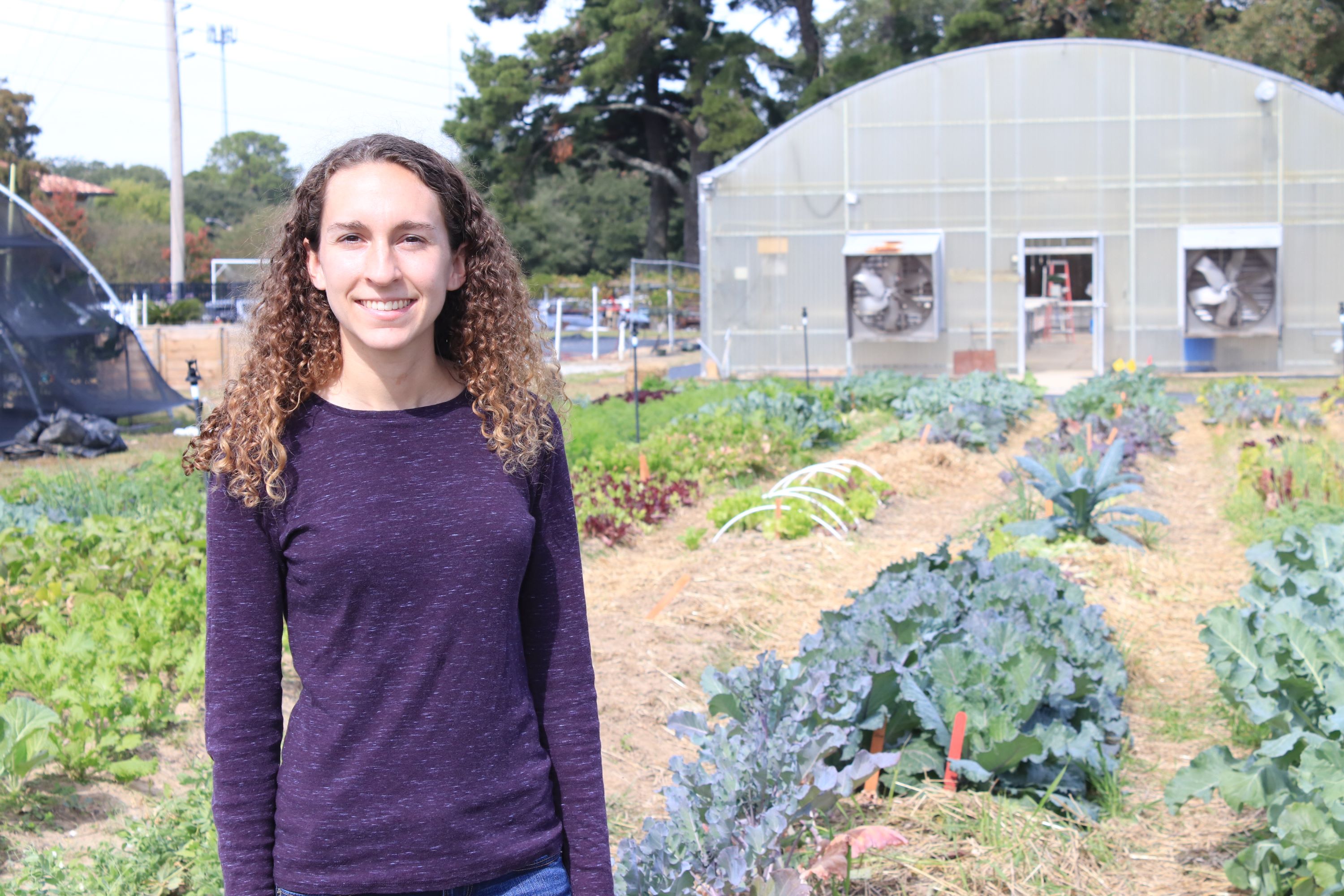 student in vegetable garden