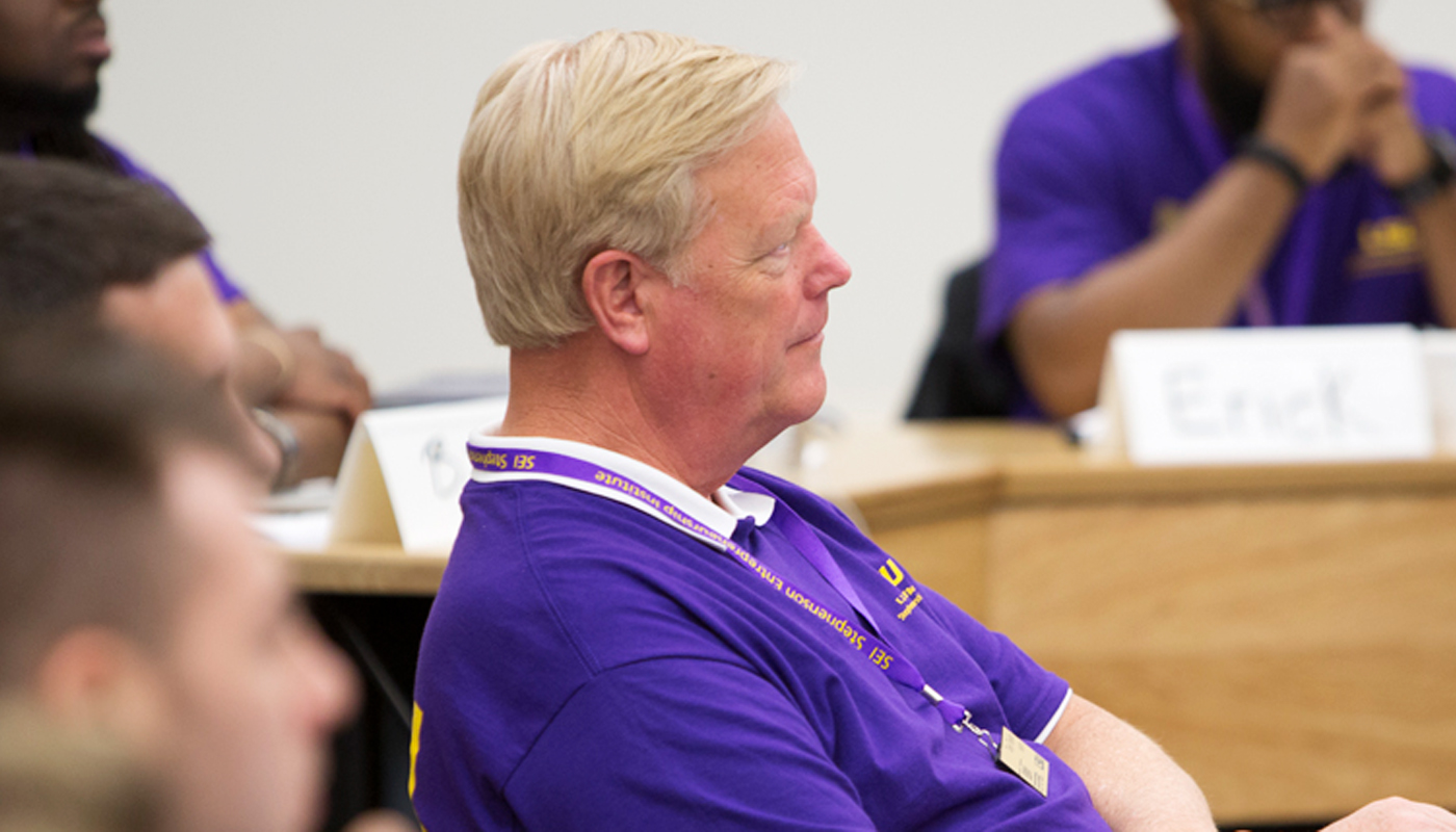 Man listens in classroom 