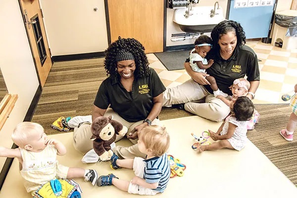 teachers playing with babies