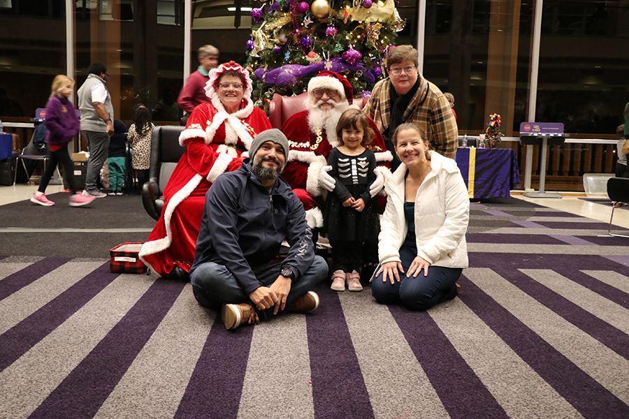 family with Santa and Mrs. Claus