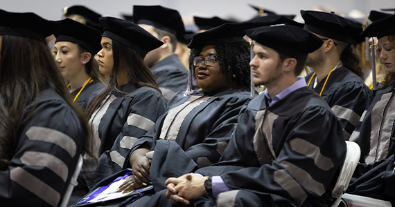 students in regalia at commencement
